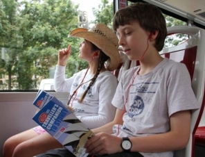 Sydney Explorer Hop On Hop Of bus tour with children enjoying the commentary